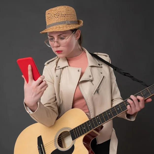 A person with a thoughtful expression is shown setting their phone aside and placing their hands on a musical instrument.