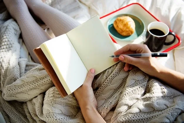 Close-up of a hand writing in a journal, a cup of tea and a cozy blanket nearby, depicting a relaxing and introspective moment.