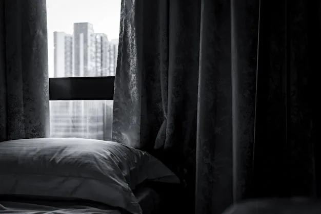 A dark and quiet bedroom setup with blackout curtains, a comfortable bed, and a white noise machine on a nightstand.