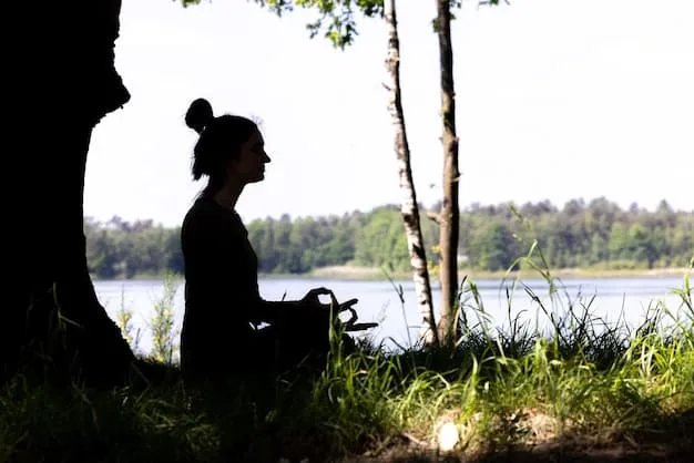 A serene image of a person meditating outdoors with their eyes closed, surrounded by nature. The focus is on their relaxed posture and controlled breathing, emphasizing the calming effect of the practice.