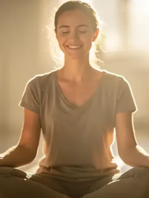Person practicing mindful self-compassion meditation in a peaceful setting