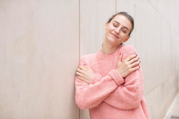 A person gently hugging themselves, with a warm and comforting expression, against a soft, neutral background, symbolizing self-soothing and self-care.