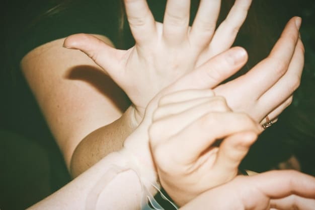 A hand gently touching another hand, symbolizing connection and support, with a blurred background of diverse people, representing common humanity.
