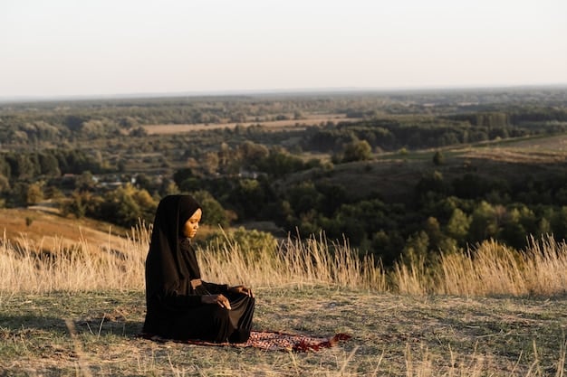 A person sitting peacefully outdoors, eyes closed, hands resting on knees, engaged in mindful meditation. The background shows a serene natural setting.
