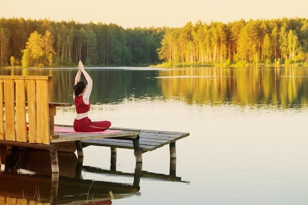 A person practicing yoga in a serene natural setting, highlighting the importance of self-care and mindfulness in building resilience. The scene is peaceful and calming, with the person appearing centered and relaxed. The background features lush greenery and a gentle, diffused light.