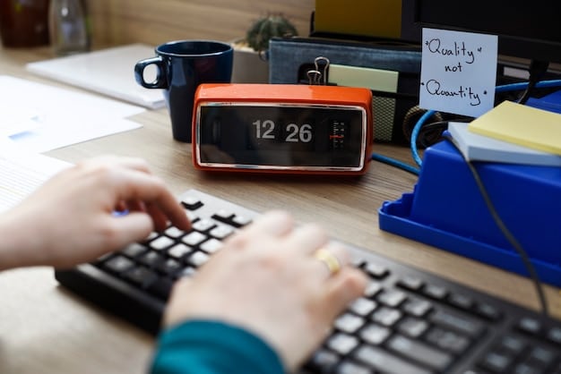 A person using a Pomodoro timer while working on a computer, illustrating the technique of working in focused intervals with short breaks in between.