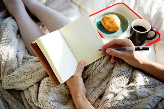 Close-up of a hand writing in a journal, a cup of tea and a cozy blanket nearby, depicting a relaxing and introspective moment.