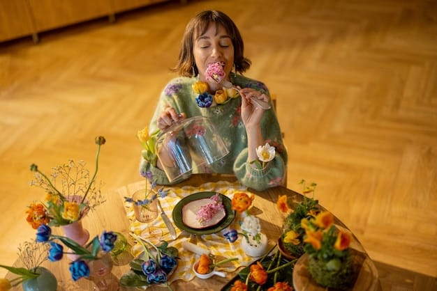 A person setting a mindful eating environment with a calming candle, a water glass, and a plate of colorful, healthy food.
