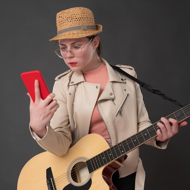 A person with a thoughtful expression is shown setting their phone aside and placing their hands on a musical instrument.