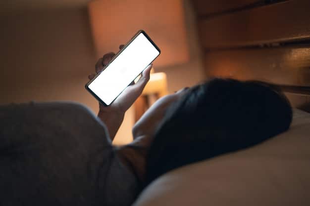 A person using a sleep tracking app on their smartphone while lying in bed, with a focus on the screen showing sleep data like sleep duration and sleep quality.