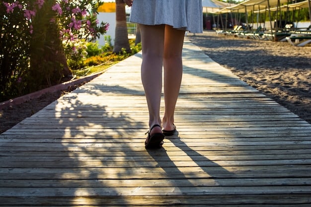 A person walking mindfully in a park, focusing on the sensation of their feet touching the ground with each step.