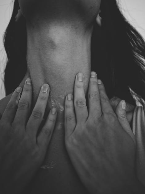 A close-up shot of a person's hands gently massaging their neck muscles, providing relief and relaxation. The background is blurred, focusing on the massage technique.