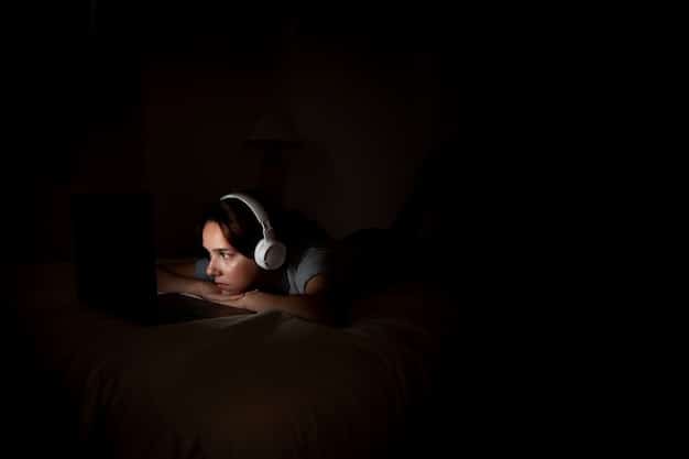 A person sleeping peacefully in a dark room, with no electronic devices visible. The scene is serene and calming.