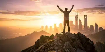 Person on mountain peak at sunrise, symbolizing mastering habits and personal growth in 90 days for 2026 in the US.