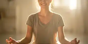 Person practicing mindful self-compassion meditation in a peaceful setting