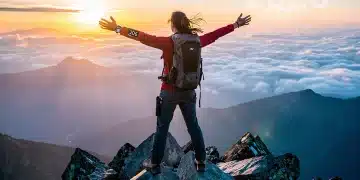 Person on mountaintop embracing personal accountability and future success in 2026